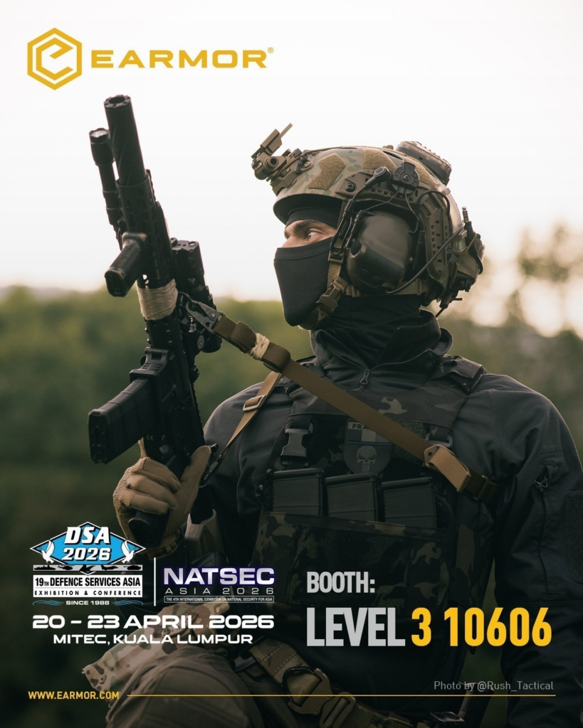 Earmor promotional poster for DSA 2026 and NATSEC Asia 2026, featuring a fully-equipped special operator with an Earmor headset, helmet, mask, and AR-style rifle against a mountain backdrop. The poster includes the DSA and NATSEC logos, event dates (20-23 April 2026), location (MITEC, Kuala Lumpur), and specific booth information: Level 3, Booth 10606. WWW.EARMOR.us